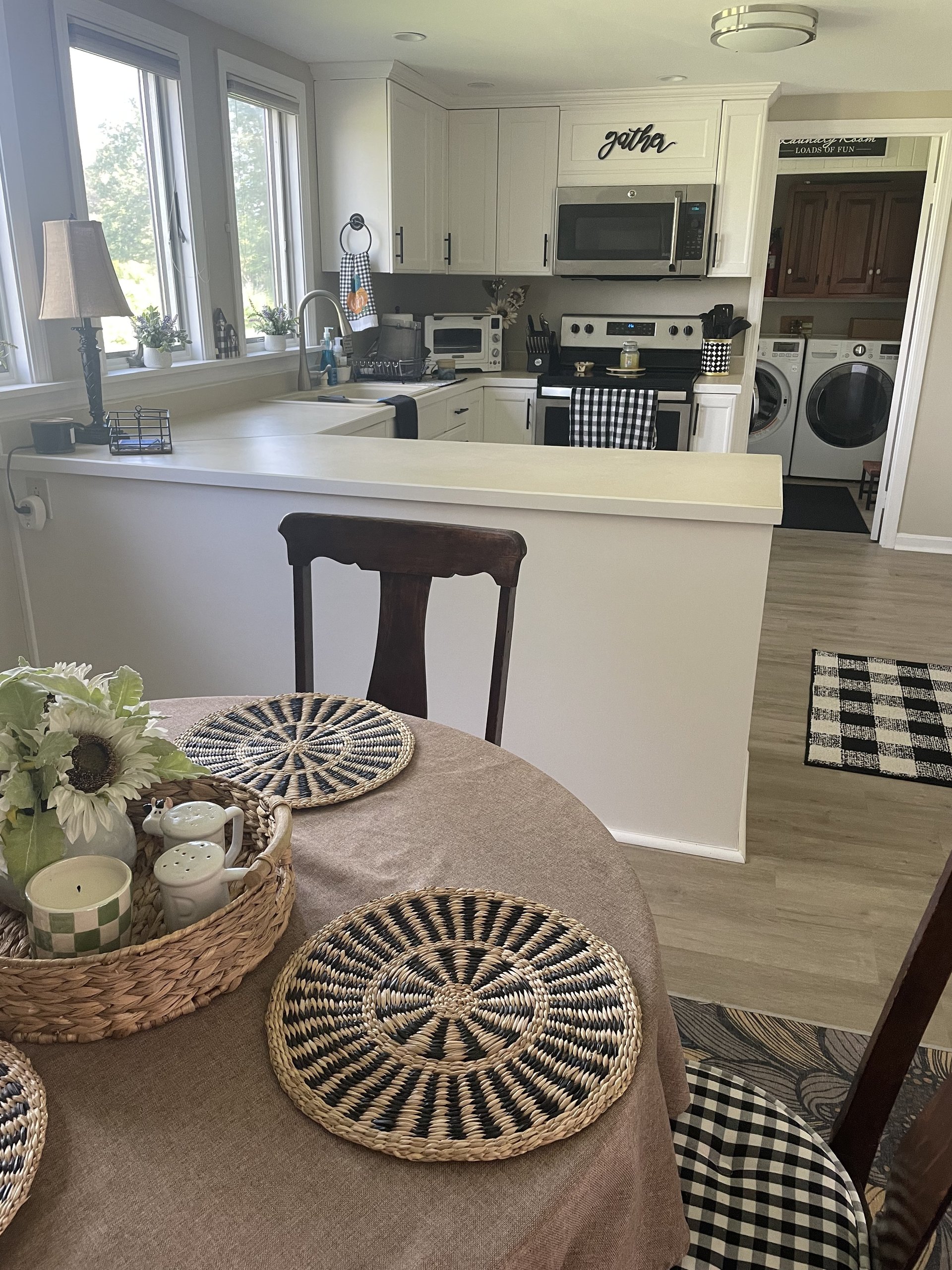 View from the dining table across the kitchen toward the laundry room