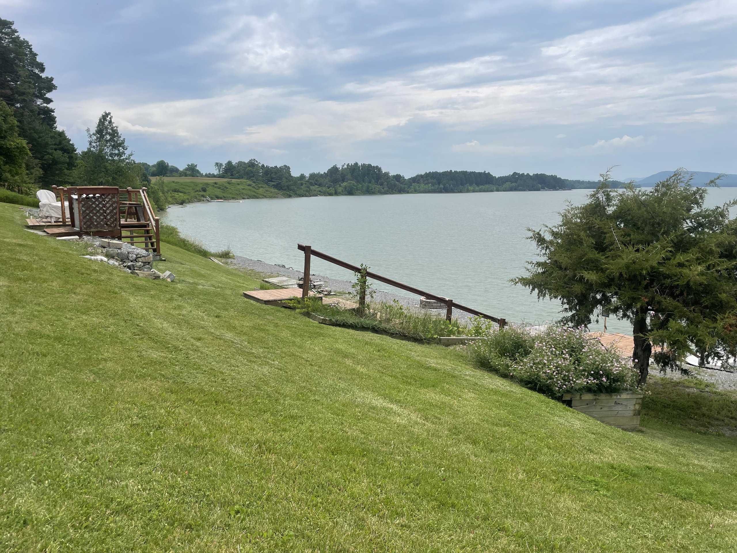 Wildflowers line the path down to the dock and lake shoreline