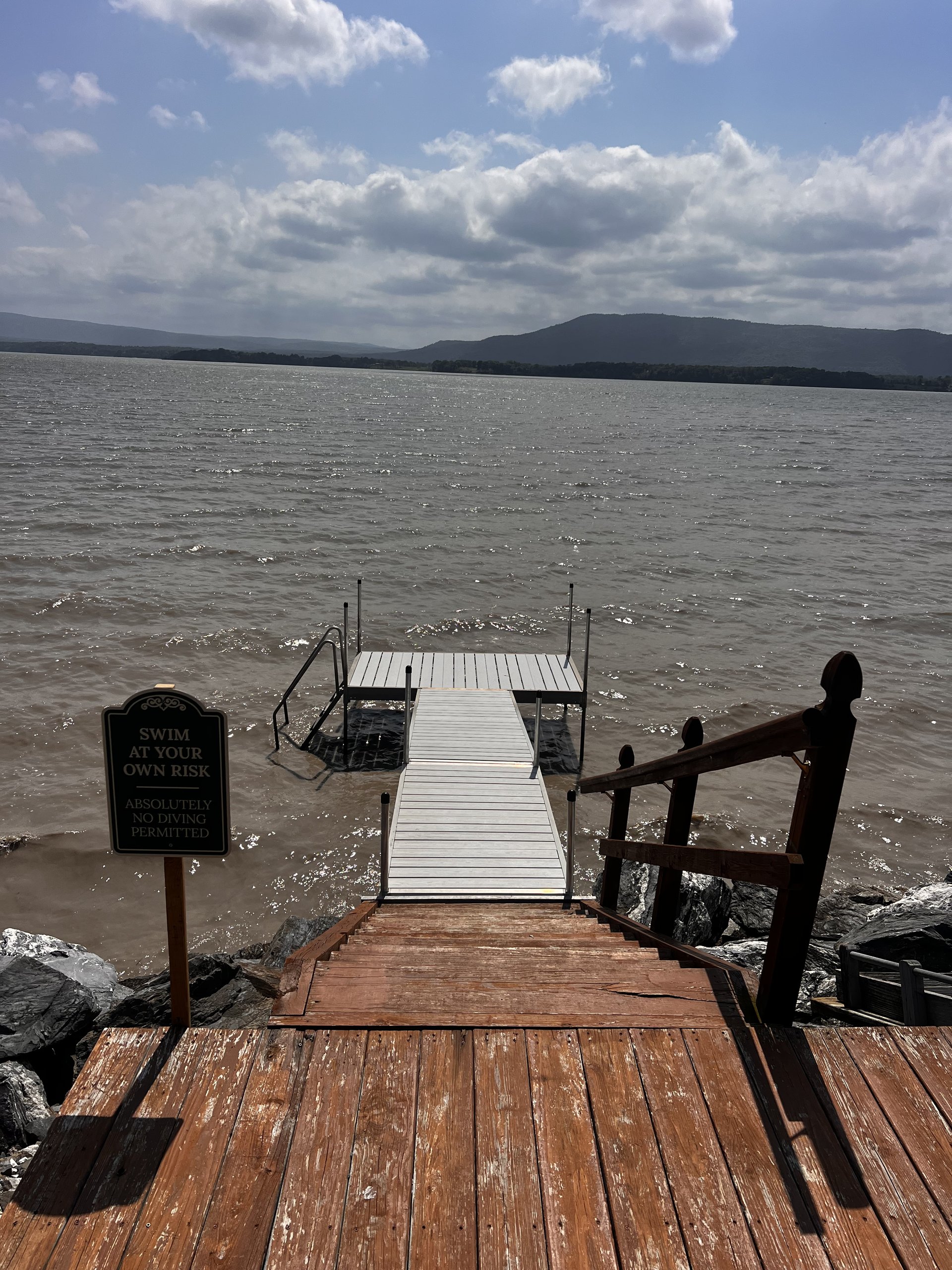 Steps lead down to the private dock on a bright, breezy day