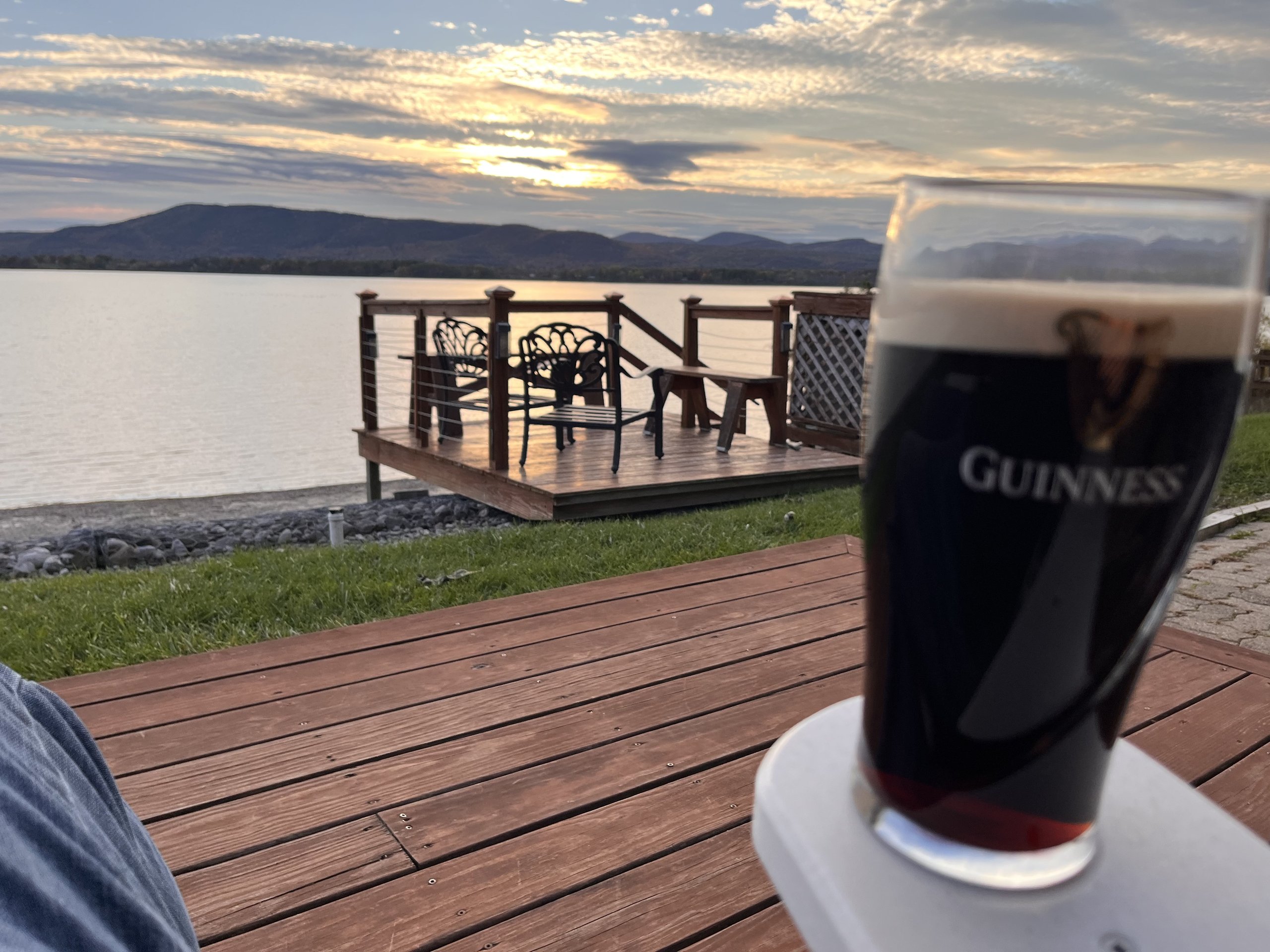 Relaxing on the deck at sunset with the lake and mountains beyond